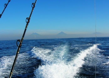 Boat wake with mountains in the distance.