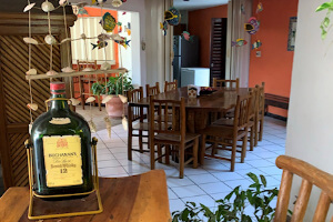 Outdoor thatched roof palapa has a fridge always full of cold local beer and a basic bar setup.