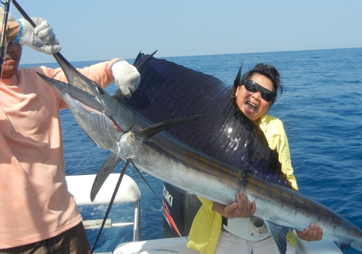 That's a big sailfish for a little lady.